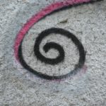 a picture of a spiral painted on a wall