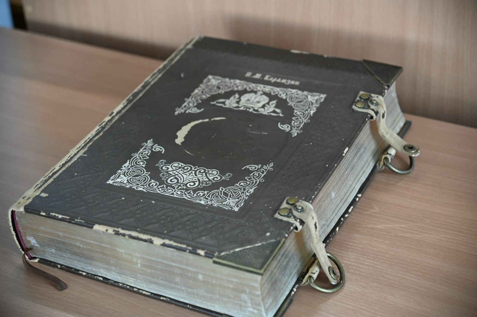 A book sitting on top of a wooden table